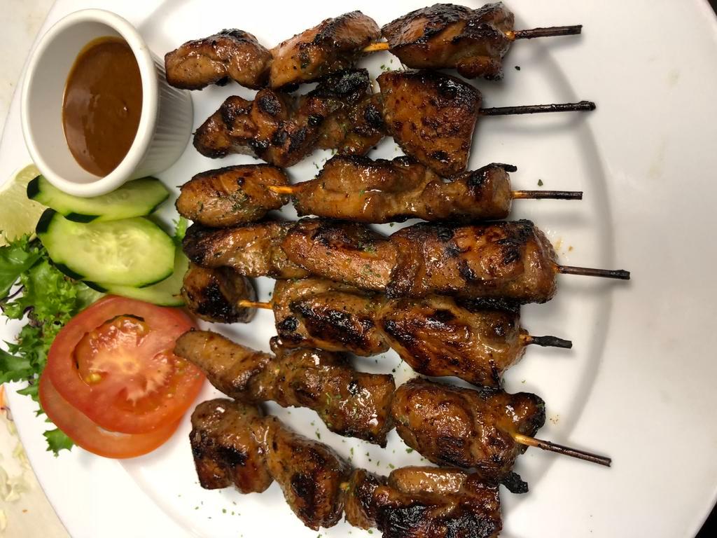 Island Satay · Grilled marinated chicken with peanut sauce. Served with soup or salad.