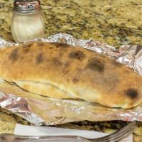 Stromboli · Stuffed with mozzarella, pepperoni, ham, salami, peppers and onions. Served with homemade sa...