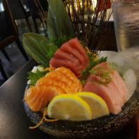 Triple Color Sashimi · 6 pieces tuna, 6 pieces salmon and 6pieces yellowtail with rice only. Served with soup and s...