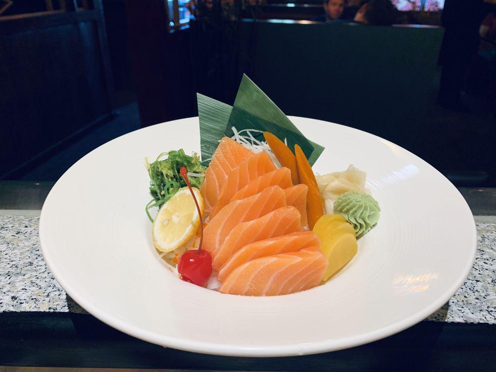 12 Pieces Salmon Don · Sliced salmon over seasoned rice. Served with soup orsalad.