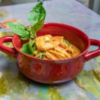 Gaeng Phed · Classic Thai red chili curry paste with peppers, young bamboo shoots, coconut milk and basil.