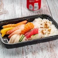 Chirashi · Assorted raw fish with tamago, kani and oshinko over sushi rice.