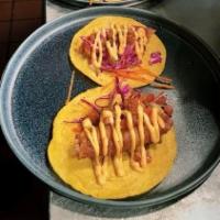 TACOS DE PESCADO · Tilapia Baja style, chipotle mayo, coleslaw, salsa morita, pico de gallo, served with rice a...