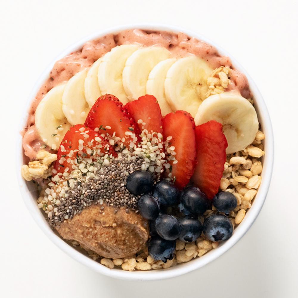 Protein Power · Packs a punch with 45g of protein! Strawberry, banana, cacao, coconut butter, vanilla whey protein, and housemade cashew milk blended together and topped with peanut butter protein granola, fresh strawberry, blueberry, banana, chia seeds, hemp hearts, a scoop of peanut butter, and agave nectar. 850 cal.