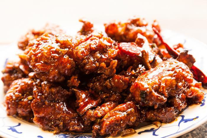 General Tso's Chicken · Chunks of dark chicken meat and dried red pepper sauteed with chef's special sauce.