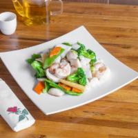 Seafood Delight · Sliced shrimp, scallops and crabmeat sauteed with vegetables in whites sauce.