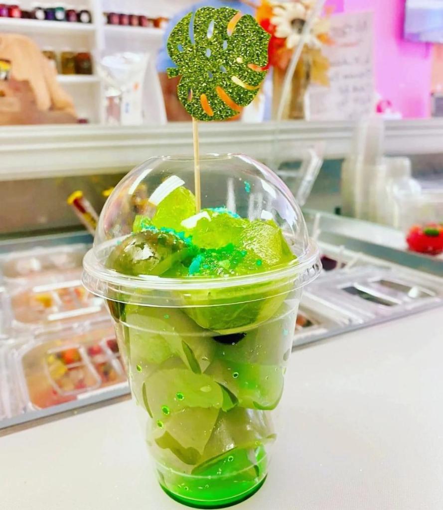 4. Jolly Green Giant  · Green Apple Jolly Rancher candy pickles with crushed green apple jolly ranchers candy, green apple pop rocks, green apple lollipop, and green apple snowcone drizzle. 