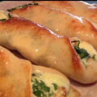 Spinach Roll · Spinach ricotta and mozzarella cheese baked in pizza dough.