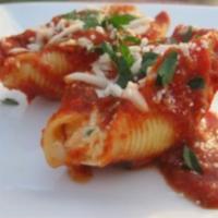 Stuffed Shells · Pasta shells stuffed with ricotta cheese. Served with our marinara sauce.