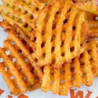 Waffle Fries · Crispy seasoned fries tossed in or classic fry seasoning or any WIO dry rub. Simply irresist...