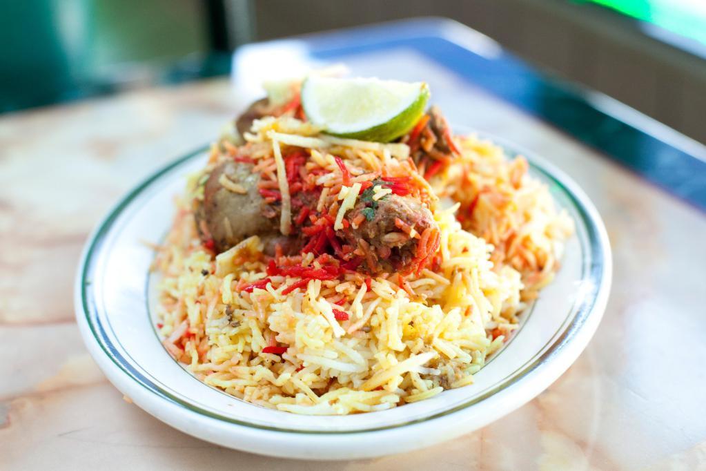 Chicken Biryani · Basmati rice cooked with chicken with aromatic flavor.