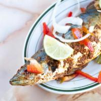 Grilled Fish · Tilapia fish, grilled on light flame, herbs and exotic spices. Priced per piece.