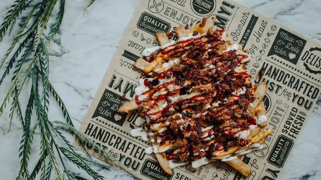 Chicken, Bacon, Ranch Loaded Fries · Beer battered fries topped with fried chicken, bacon, ranch, nacho cheese, ＆ BBQ sauce