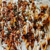 Baked Potato Loaded Fries · Beer battered fries topped with sour cream, bacon, nacho cheese, ＆ chives