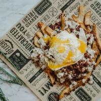 Breakfast Loaded Fries · Beer battered fries topped with sausage gravy, bacon ＆ a fried egg