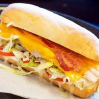 Turkey Bacon Ranch Sub · Sliced turkey breast, crispy bacon, and cheddar cheese with Roma tomatoes, lettuce, and our ...