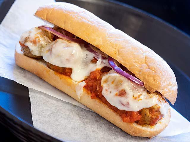 Meatball Sub · Italian meatballs in marinara sauce, provolone cheese, and red onion toasted on a French roll.