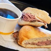 French Dip Sub · Sliced roast beef, red onion, and provolone cheese, toasted on a french roll with piping hot...