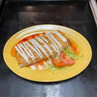 Wet Burrito · one burrito filled with rice beans cheese and choice of meat with tomatoe s sauce on top and...
