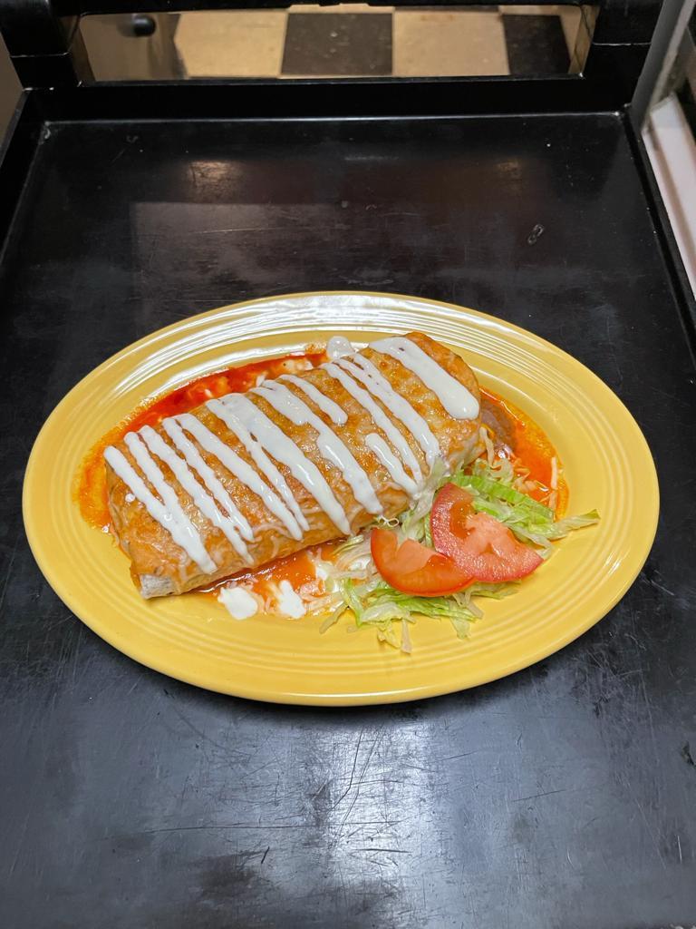 Wet Burrito · one burrito filled with rice beans cheese and choice of meat with tomatoe s sauce on top and melted cheese 