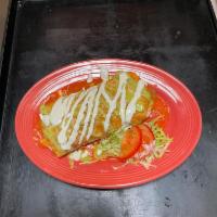 Fajita wet burrito · wet burrito filled with steak/ chicken mushrooms bell peppers rice beans avocado with tomato...