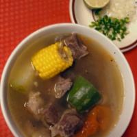 Caldo De Res · beef soup with vegetables and tortillas onions chile verde and lime on the side with side of...