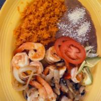 Camarones Ajo · shrimp mushrooms onions and bell peppers in garlic sauce rice beans and tortillas 