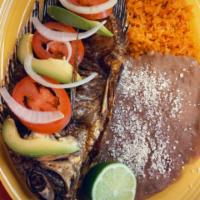 Mojarra frita  · whole fish deep fried rice beans salad and tortillas 