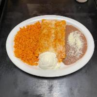 Enchiladas PLate  · two enchiladas choice of meat rice and beans one scoop of sour cream