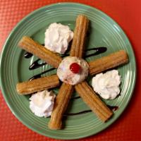 Churros with ice cream · 6 piece of churros 1 scoop of ice cream whipped cream and chocolate 