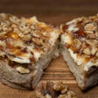 Brie and Fig Jam Toast · Brie and fig jam, topped with walnuts and honey drizzle on multigrain toast.