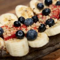 Nut Butter and Fruit Toast · Almond butter, bananas, strawberries, blueberries, granola, honey drizzle on multigrain toast.