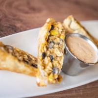 Southwest Egg Rolls · Crispy egg rolls stuffed with chicken, corn, black beans and cheese. Served with zest southw...
