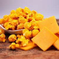 Cheddar · We  mix the perfect portion of real melted cheddar with our fresh popped popcorn. You won’t ...