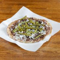 29-A. Huarache · Big corn tortilla, beans, onion, Mexican cheese, cactus leaf and meat.