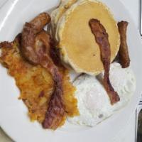 Hungry Man Special · Pancakes, two eggs, ham, bacon, sausage, home fries and toast.