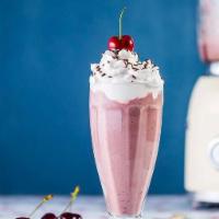 Cherry vanilla milkshake  · 3 scope of vanilla ice cream, splash of milk, cherry sauce.