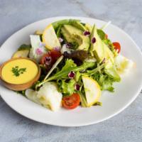 The House Salad · Our special house salad. Fresh vegetables tossed in lettuce and dressed with a homemade dres...