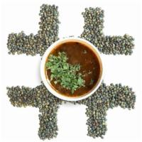 Green Lentil Soup · French lentil cooked with sauteed onions and tomato and finished with rich and refreshing su...