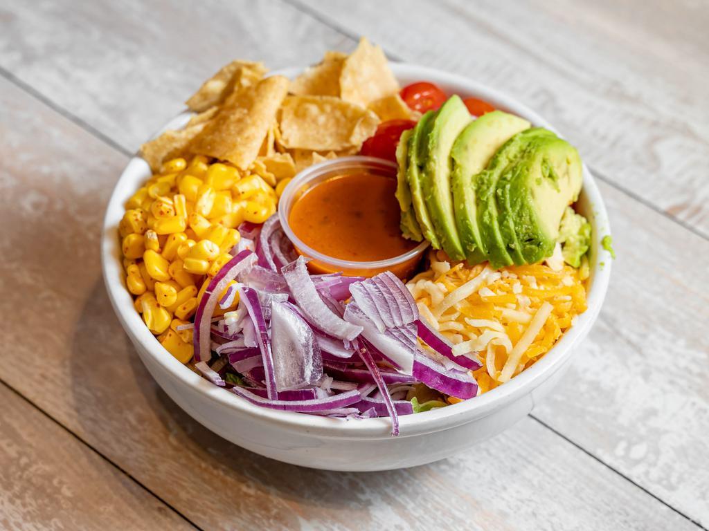Santa Fe Salad · Avocado, Roasted Corn, Cheddar Cheese, Tomatoes, Red Onions, Tortilla Chips, & Crisp Romaine Lettuce.
We Recommend Chipotle Vinaigrette Dressing.