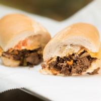 Philly Cheese Steak Sandwich · Cooked peppers and onions and cheese.