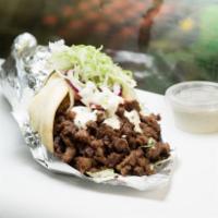 Gyro · Chicken or lamb with cooked onions and peppers, lettuce, tomatoes and white sauce.