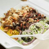 NYC Style Platter over Rice · Chicken, lamb or mix, cooked onions and peppers, lettuce, pita and white sauce.