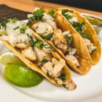 Chicken Tacos · 3 White meat chicken tacos served with chopped white onions, cilantro, lime wedges, and sals...