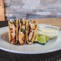 Shrimp Tacos · 3 grilled shrimp tacos topped with pico de gallo, cilantro, and our famous house made baja s...