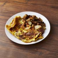 The Western Omelette Breakfast · Ham, red and green peppers, onions and Jack cheese. Served with choice of side and bread or ...