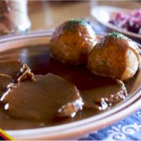 Sauerbraten · Select beef is marinated and then roasted to create this German classic. Served with potato ...
