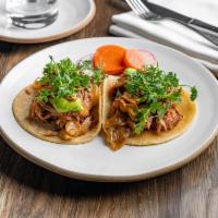 Carnitas Tacos (2 per order) · Pork, pickled onions, cilantro.