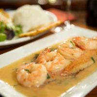 Pescado al Horno con Camarones · Oven cooked fish with white sauce mixed with shrimps. Chunks of fried fish, with french frie...