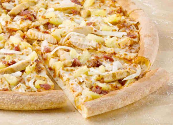 Hawaiian BBQ Chicken Original Crust Pizza · Smothered in zesty BBQ sauce, it's topped with grilled all-white chicken, bacon, fresh-sliced onions and sweet, juicy pineapple tidbits for a taste of the tropics.